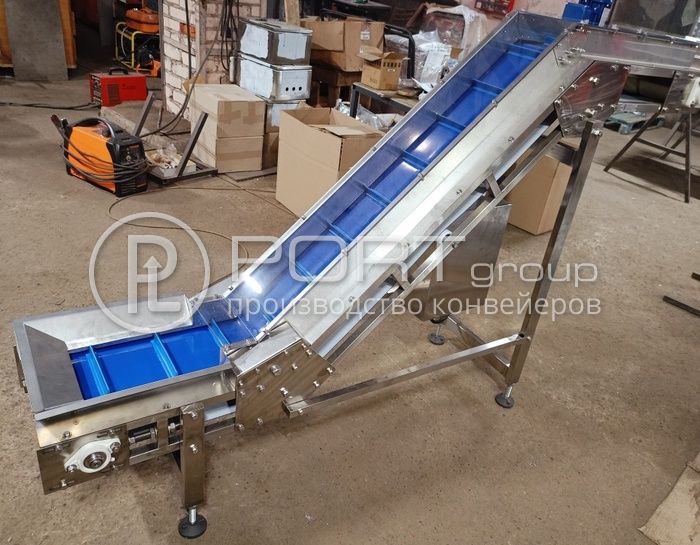 Конвейер перемещения мелких штучных грузов с одного уровня на другой